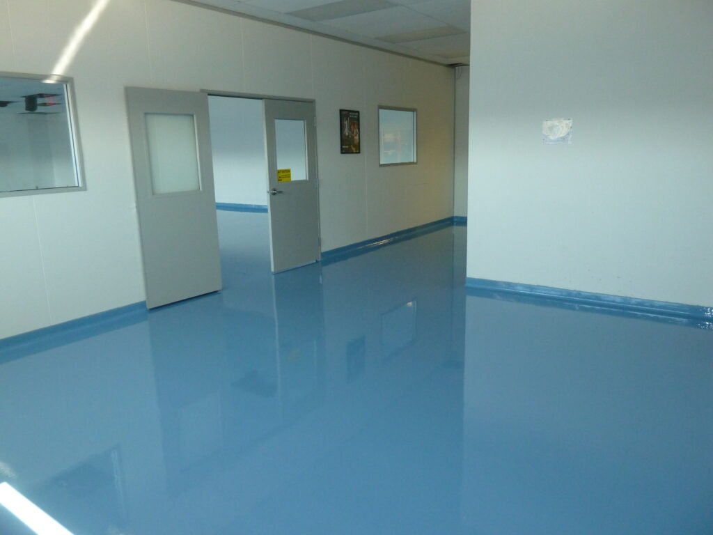 Blue polyaspartic concrete coating installed in a scientific laboratory.