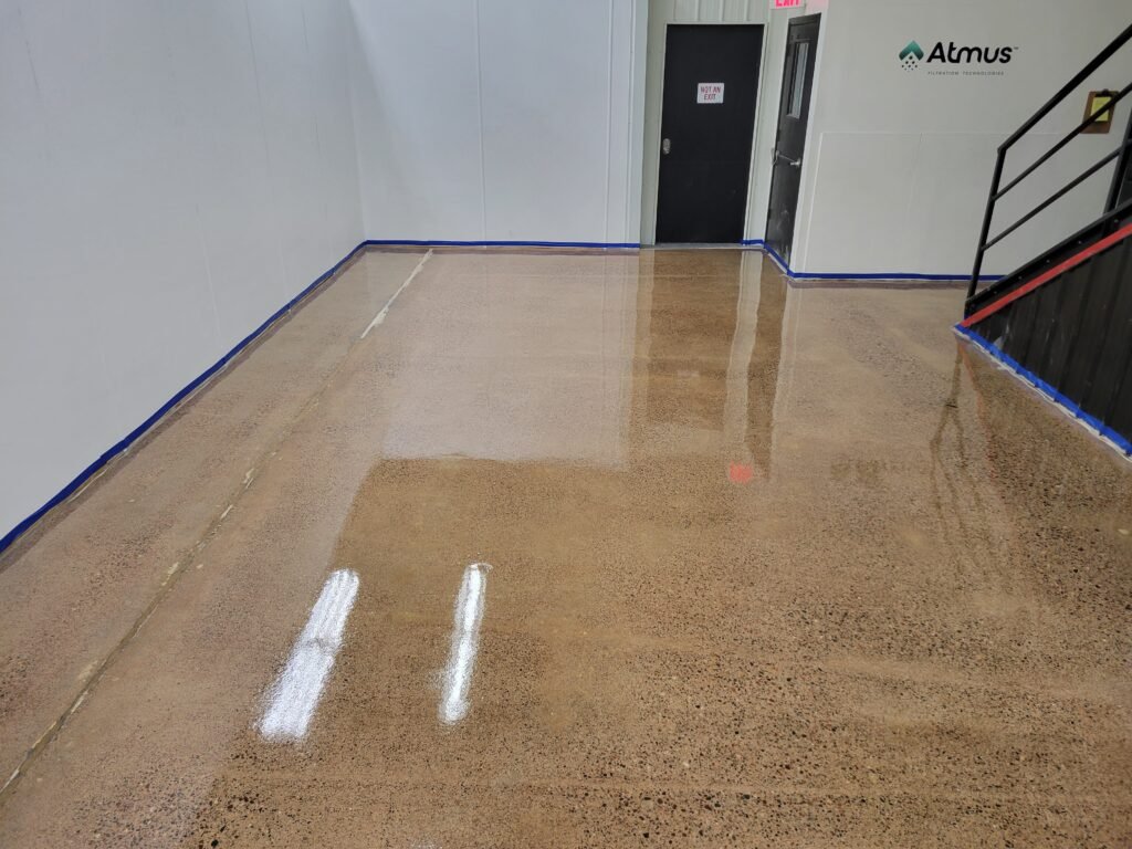 A clear polyaspartic concrete coating installed in a factory in Wisconsin showing the smooth and glossy finish.