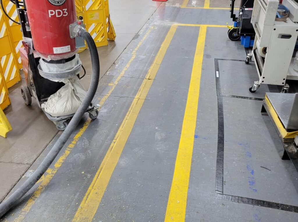 A photo of an old concrete coating that was no longer wanted and so was ground down in the concrete polishing process.