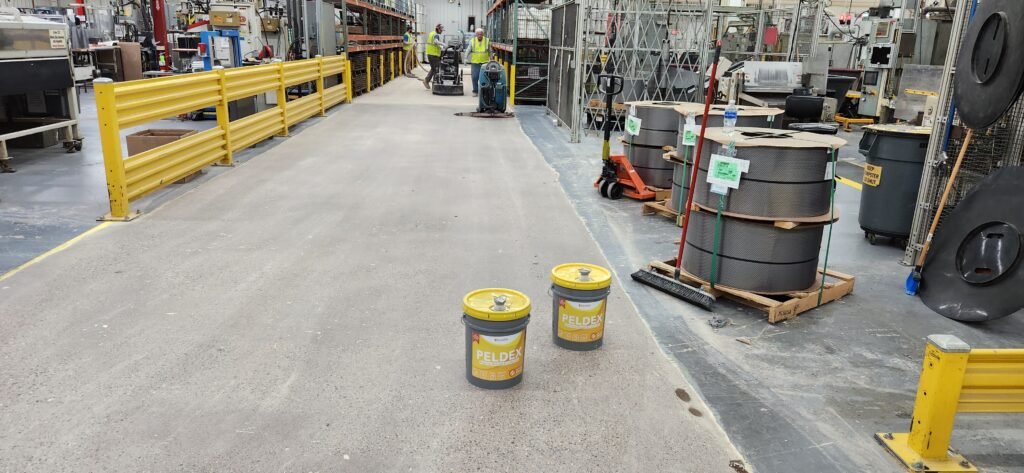 Before applying Peldex concrete densifier to ground concrete as a part of the concrete polishing process. Used for a webpage for Eau Claire Concrete Polishing.