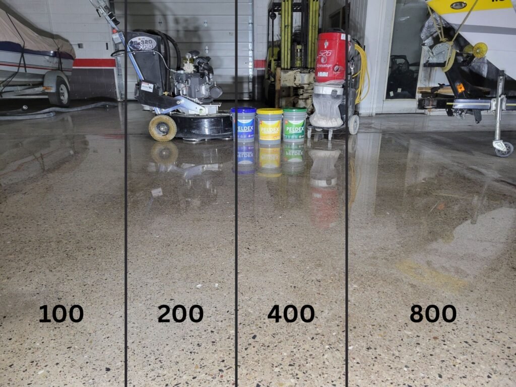 This shows a floor that was ground to four different concrete polishing steps to show the difference in luster of each level.