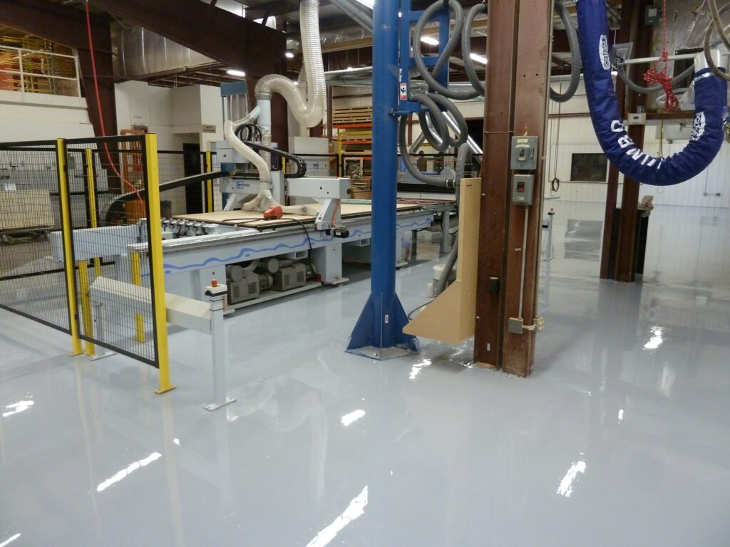 A wood cabinet shop with a gray dyed polyaspartic floor that was installed by WISE in Wisconsin.