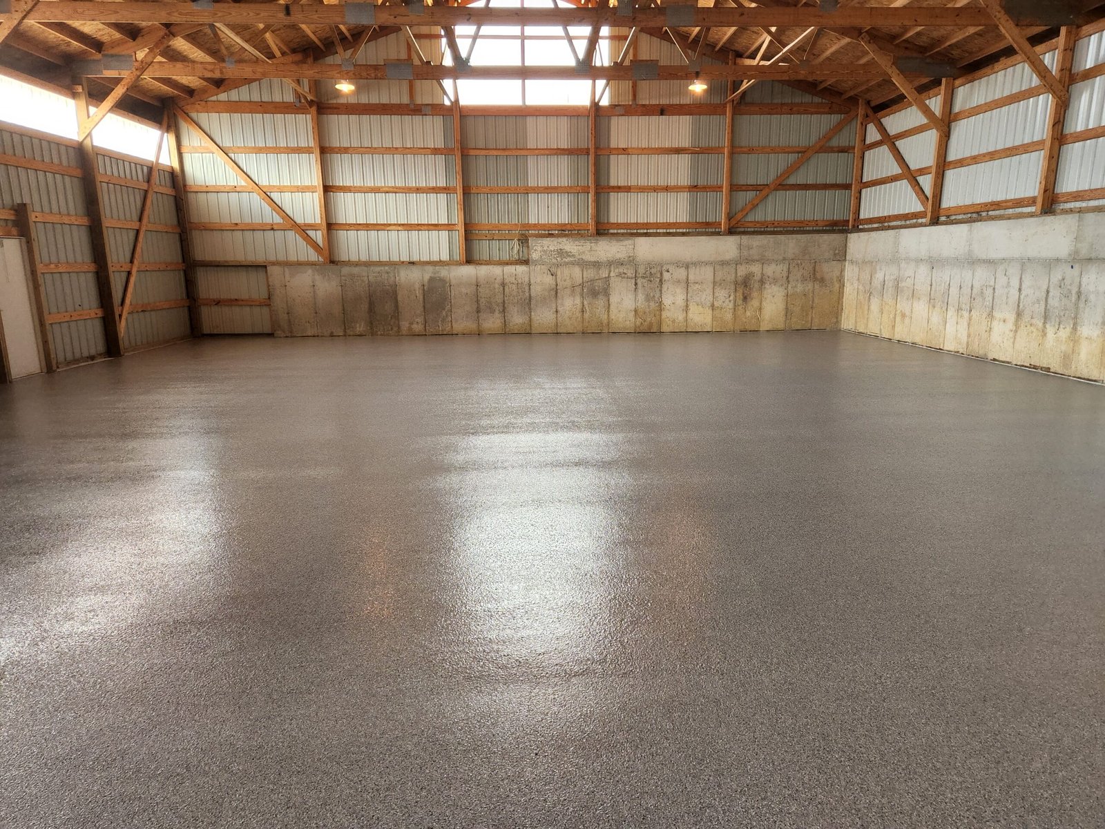 A salt and pepper style polyaspartic chip floor installed in a industrial warehouse in Wisconsin for a more visually appealing floor.