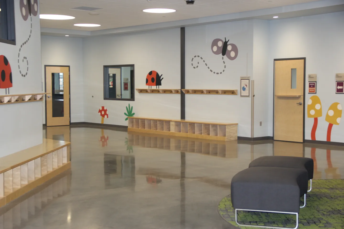 High-gloss polished concrete with a smooth and durable finish showing reflectivity of walls and shelving. Completed in a church in Wisconsin.