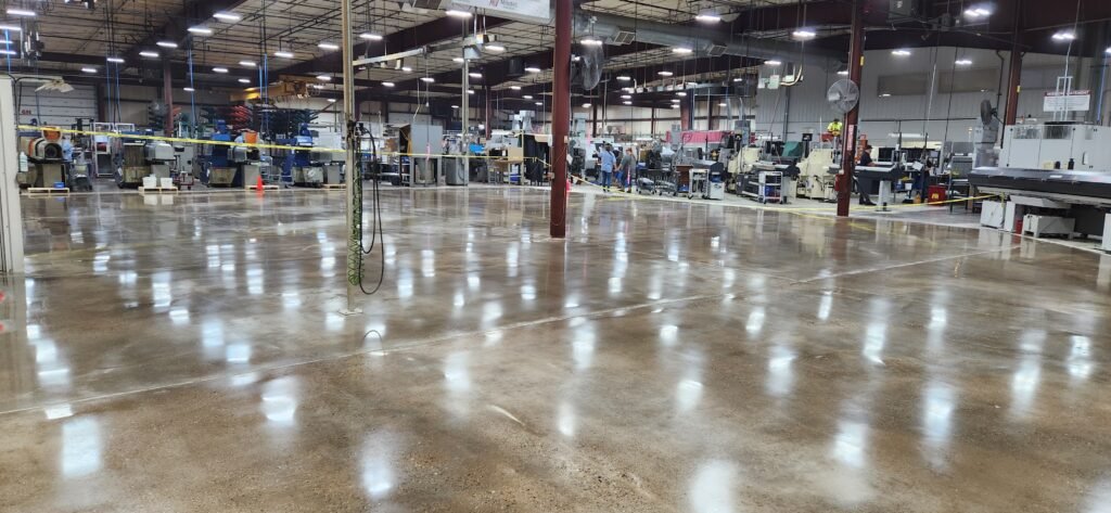 Polished concrete in an industrial manufacturing plant in Wisconsin showing the smooth and highly reflective finish of the floor.