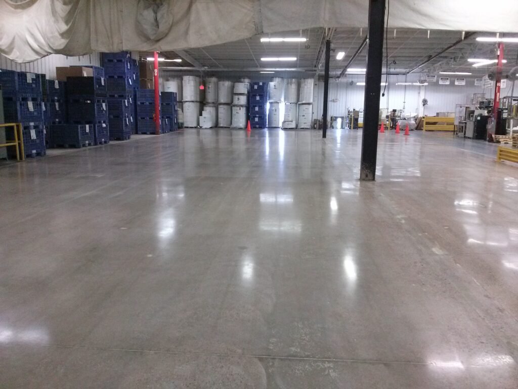 Polished concrete installed in an industrial facility in Wisconsin showing the reflectivity and smoothness of the floor.