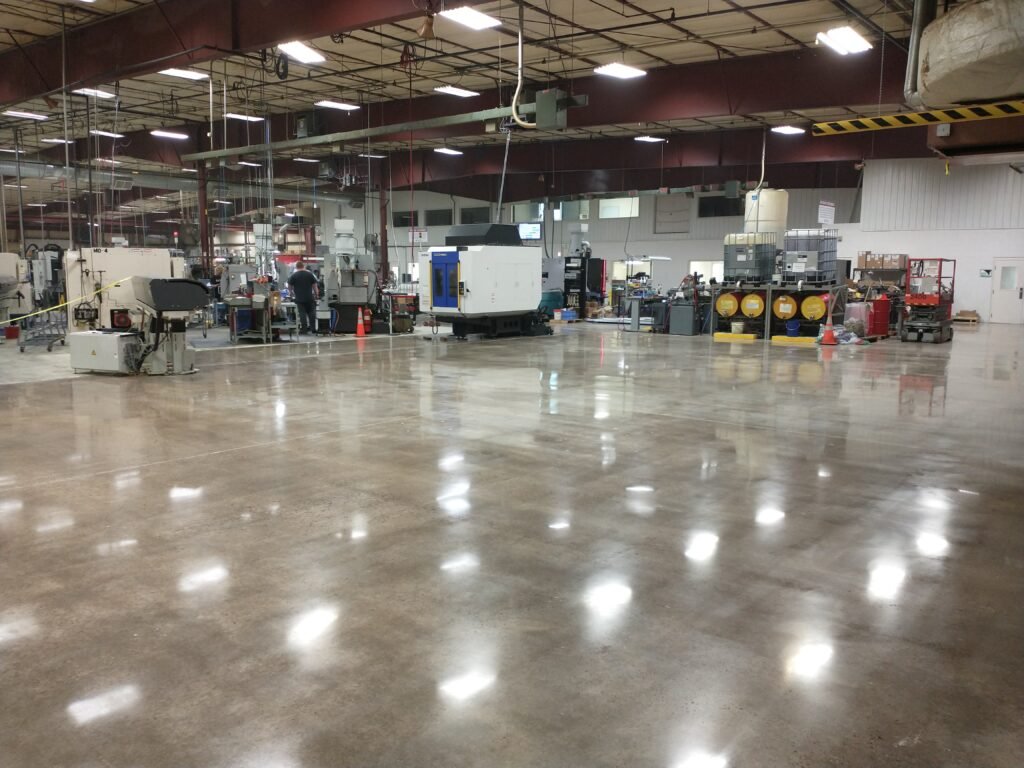 Mid luster polished concrete floor showing a more durable and easily maintainable industrial workspace completed in a manufacturing plant based in Wisconsin.