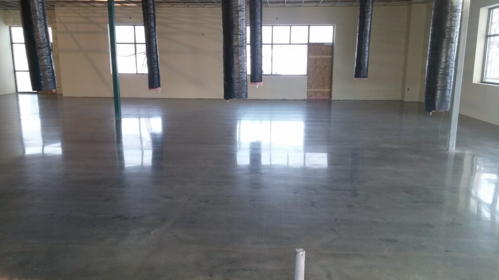 Polished concrete floor in Madison, Wisconsin that shows the reflectivity of the windows in the floor.