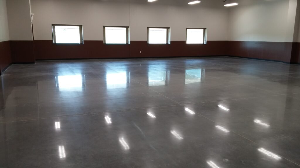 A polished concrete floor completed in Madison, Wisconsin showing the light of the windows reflecting off the floor.