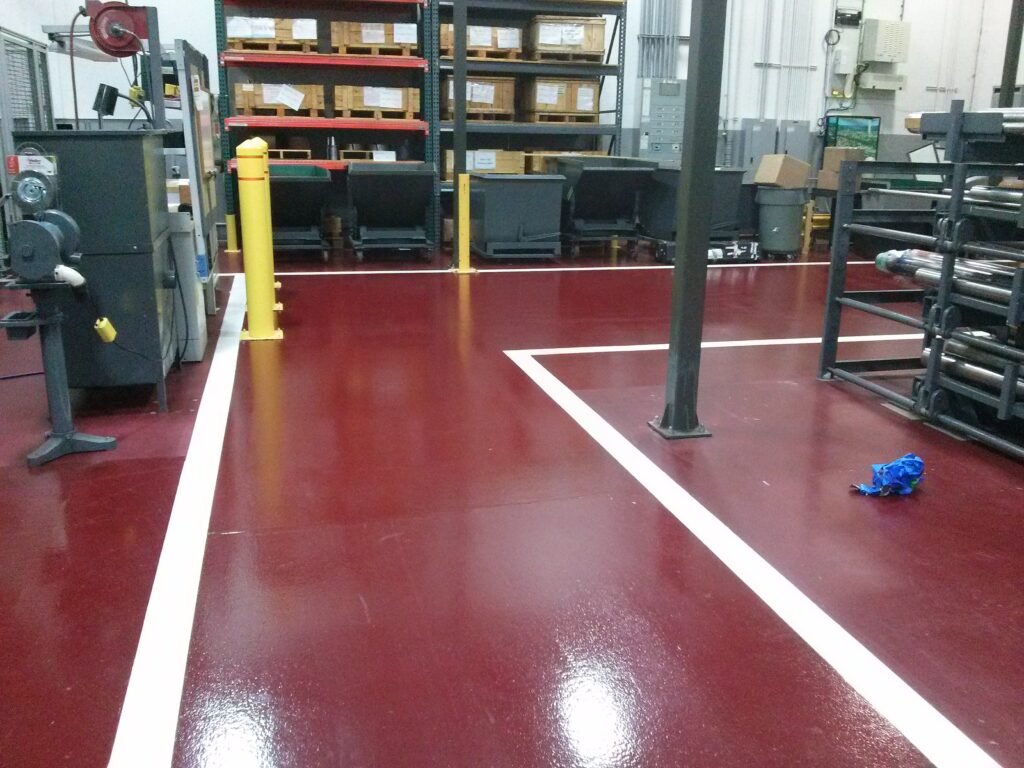 Red polyaspartic concrete coating that was installed in an industrial facility in Wisconsin.