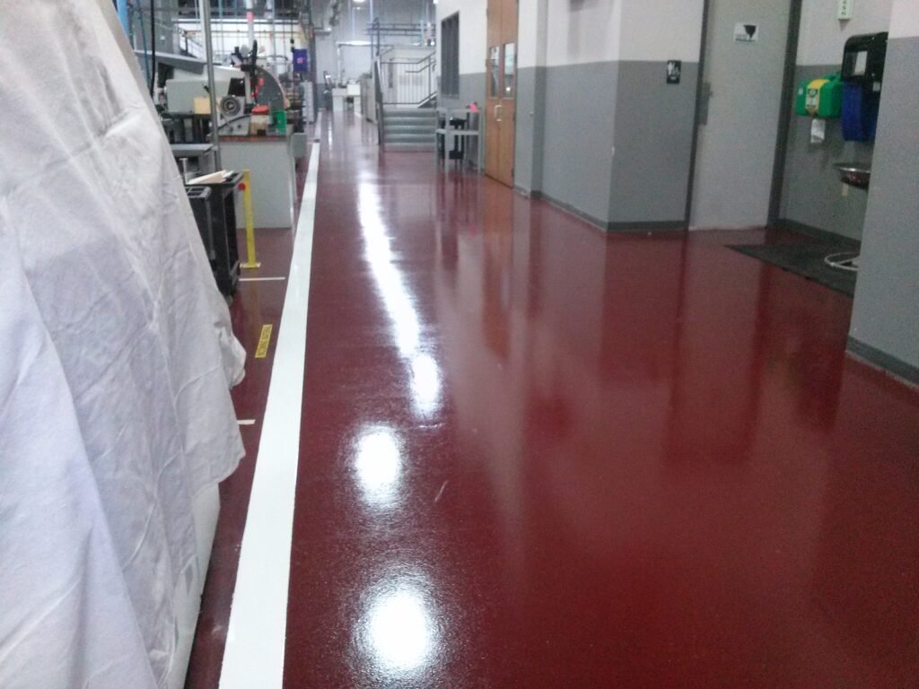 Red polyaspartic concrete coating that was installed in an industrial facility in Wisconsin.