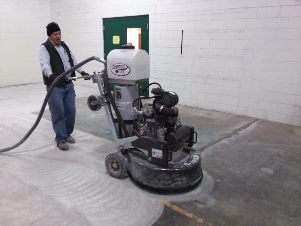 The first grind in the concrete polishing process used to show the process of polishing concrete on an Eau Claire concrete polishing page.