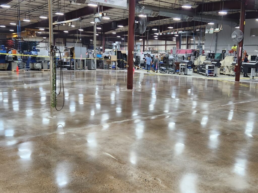 Polished concrete in an industrial manufacturing plant in Wisconsin showing the smooth and highly reflective finish of the floor.