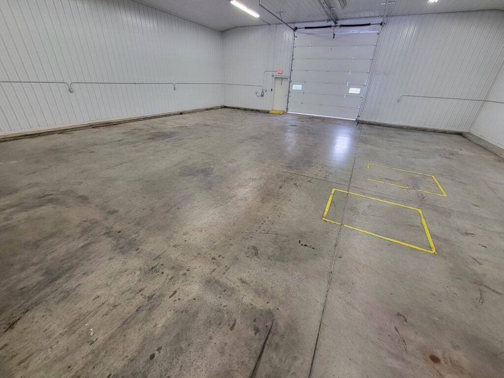 A floor in Montello, Wisconsin that was cleaned by Wisconsin Industrial Services & Equipment using a rideable sweeper scrubber machine with a strong commercial strength detergent.