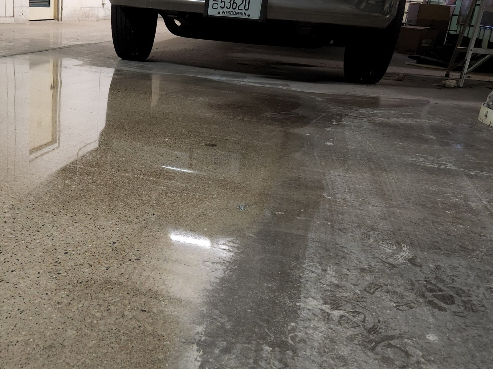 Concrete floor restoration that shows the difference between the old floor and the new polished concrete floor.