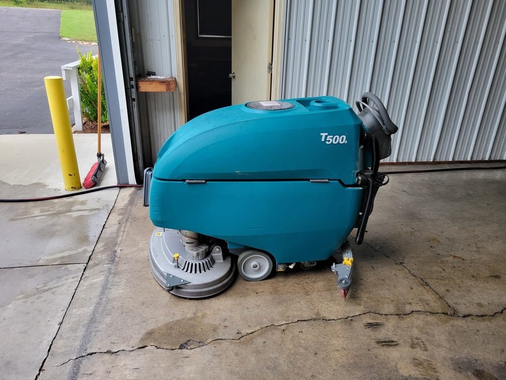 Walk behind sweeper scrubber which is a tenant t500.